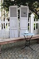 A pair of decorative old French shutters with light gray color and good 
patina...