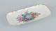 Bing & 
Grøndahl, stort 
aflangt fad 
håndmalet med 
polykrome 
blomstermotiver 
og guldkant.
Ca. ...
