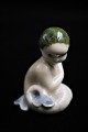 Royal 
Copenhagen 
porcelænsfigur 
af lille 
havfrue.
Højde: 5cm. 
Dekorationsnummer: 
2313. ...