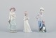 Three Nao porcelain figurines. Boys and girls with pets.