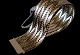 Geneve Armbånd 
3 Rk 14 karat 
guld
Stemplet CHL 
585
Længde 19,5 cm
Brede 27,28 mm
Tykkelse ...
