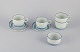 Stig Lindberg for Gustavsberg. A set of four "Dart" stoneware coffee cups and 
saucers, along with a sugar bowl. Hand-painted.