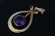 Beautiful and 
classic pendant 
in 14 carat 585 
gold, with 
inlaid purple 
amethyst. The 
piece is ...