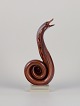 Murano, 
Italien. Stor 
skulptur 
forestillende 
kobraslange 
udført i 
kunstglas. Glas 
i brune og ...