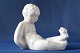Fin lille 
liggende dreng 
med frø, fra 
Bornholm 
designet af 
Michael 
Andersen. 
Udført i 
keramik, ...