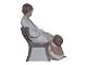 Stor Bing & Grøndahl figur, mor i stol med barn.Fabriksmærket viser, at denne er produceret ...