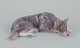 Bing & Grøndahl 
porcelænsfigur 
af liggende 
schæferhund.
Ca 1930.
Model: 1789.
Første ...