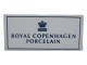 Royal Copenhagen Porcelain forhandlerskilt.Længde 14,0 cm.Perfekt stand uden fejl.