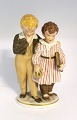 Royal Copenhagen. Porcelain figurine with colors. The escape to America. Model 
1761. Height 21 cm. (1 quality)