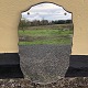 Spejl i fin facon monteret på træplade. Mål: 62x37 cm