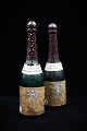 Dekorativ , gammel champagne flaske , drejet i træ , hul indeni med låg i bunden. H: 26,5cm. ...