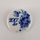 200 års 
jubilæums 
broche af 
porcelæn, 
dekoreret som 
stellet Blå 
blomst
Producent 
Royal ...