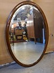 Spejl i 
mahogni, fra 
1920erne.
Det har 
brugsspor.
Højde 84cm 
Bredde 59cm