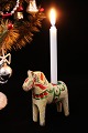Decorative, old Swedish Dalar horse in off-white painting with room for a small 
Christmas candle on the back...