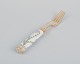 Royal Copenhagen Flora Danica/Georg Jensen. Dinner fork, hand-painted with Flora Danica motif. Forkhead by Anton Michelsen in gilt sterling silver.