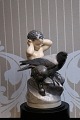 Royal 
Copenhagen 
porcelæns figur 
af Faun og 
krage.
Dekorationsnummer: 
2113. 1.sort. 
Højde: ...