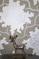 Decorative, old reindeer in metal decorated with rhinestones and crystals in 
glass from Bohemia. H:9cm.