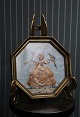 Decorative 8-sided collage picture of a fine woman with a parrot made of dried 
flowers framed in a brass frame...
