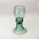 Rømerglas i 
klart grønt 
glas, et glas 
som måske er 
fra omkring 
1800
Fremstår med 
ujævnheder i 
...