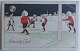 Julepostkort: 
Nisser spiller 
fodbold. Tegnet 
af svenske Emil 
Pehrson 
(1883-1935). 
Annulleret ...