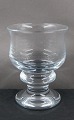 Holmegård 
Tivoliglas, 
designet af Per 
Lütken. 
Hvidvinsglas i 
fin stand. 
H 10cm - Ø 
7,5cm  ...