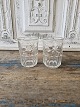 Vandglas 
dekoreret med 
måne og 
stjerner udført 
i presset glas
Højde 9,5 cm.
Lager: 2