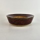 Skål af keramik 
i brunlige 
nuancer. Nr. 2H 
34
Formgiver 
Edith Sonne 
Bruun ...