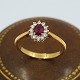 Ring i 18 kt. guld, prydet med rubin og 12 diamanter fattet i hvidguld, i alt 0.24 ct.Ring ...