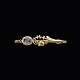 Just Andersen. 
Broche i 14k 
guld med safir.
