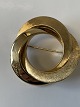 14 Karat guld 
broche 
Stemplet: . 
585
Diameter  3,6 
cm.
Flot og 
Velholdt.
Smykket ...