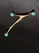 14 karat guld 
moderne broche 
med turkiser