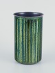 Norsk designer.
Emaljeret 
kobbervase.
Cylindrisk 
form. Blanke 
grønne og blå 
toner.
Ca. ...