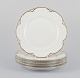 Et sæt på fem 
"Haviland" 
middagstallerkener 
af porcelæn.
Hånddekoreret 
gulddekoration, 
hvidt ...