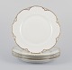 Et sæt på fire 
Haviland 
middagstallerkener 
af porcelæn.
Hånddekoreret 
gulddekoration, 
hvidt ...