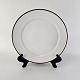 Middagstallerken 
i porcelæn fra 
stellet Brun 
Domino
Nr 14933
Producent 
Royal ...