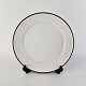 Frokosttallerken 
i porcelæn fra 
stellet Brun 
Domino
Nr 14924
Producent 
Royal ...