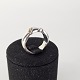 Fingerring i 
sterling sølv 
med dekoration 
i 18 kt guld
Formgiver Ole 
Kortzau
Producent 
Georg ...