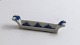 Royal 
Copenhagen. 
Musselmalet, 
riflet. 
Knivbænk. Model 
2311. Længde 
7,5 cm. (1 
sortering)