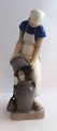 Bing & Grondahl. Porcelain figurine. Girl with milk churn. Model 2181. Height 
21.5 cm. (1 quality).