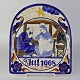 Ældre 
juleplatte fra 
år 1908 med 
motiv af Josef 
og Maria i 
stalden med 
lille barn 
Jesus omgivet 
...