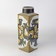 Vase i fajance 
fra serien Baca 
med motiv af 
fabeldyr i 
brunlige 
nuancer. Nr. 
...