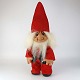 Figur i 
naturgummi med 
tøj af rødt 
filt og motiv 
af Bedstefar 
juletrold. 
Model X-mas 
Grandpa nr. ...