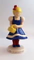 Søholm. Irma 
pige. Irmas 100 
års jubilæum 
1886 - 1986. 
Højde 20,5 cm.