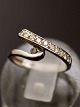 14 karat 
hvidguld ring 
størrelse 48 
med adskillige 
diamanter 
stemplet 14K 
emne nr. 618469