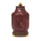 Jais Nielsen, 
1885-1961, for 
Royal 
Copenhagen: 
Lågvase i 
okseblodsglasur 
med patineret 
og ...