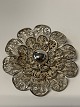 Filigran Broche 
sterling sølv.
Stemplet JAG 
Sterling 
Denmark.
Diameter 3,9 
cm. 
Pæn og ...