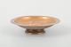 Bronce, Danish 
design
Footed bowl in 
a classic form.
Cast and 
turned bronce 
with warm ...
