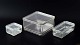 Bauhaus – 
Wilhelm 
Wagenfeld
Set of three 
rectangular 
storage boxes 
in pressed 
glass. Clear 
...