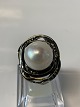 Designers Favorite ring with pearl and stone, Sterling silver.
Size 60.