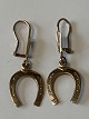 Earrings in 8 carat gold with horseshoe.
Length 3.4 cm.